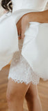 Close-up of a white lace garment with a blurred background