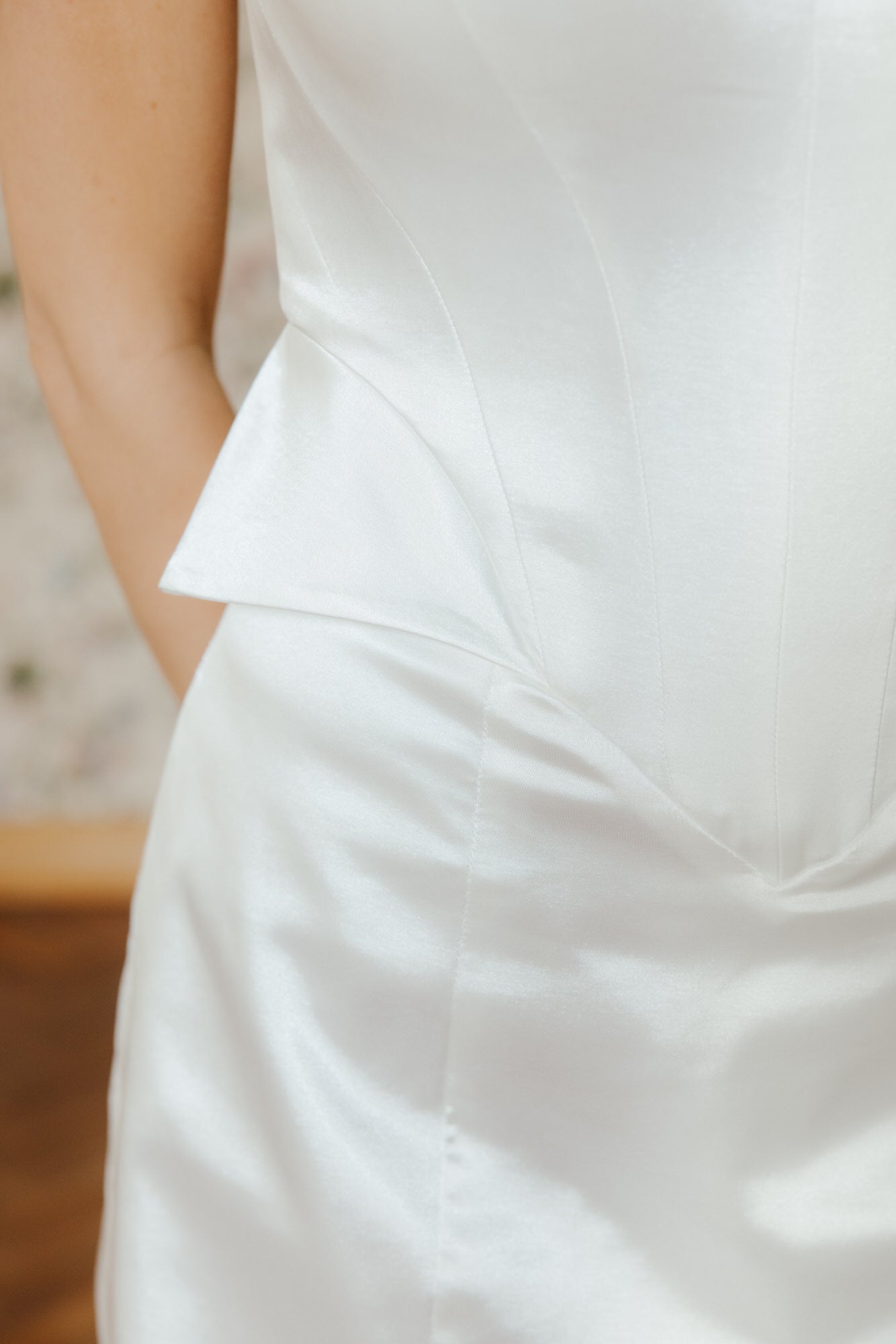 Close-up of a white dress with a blurred background
